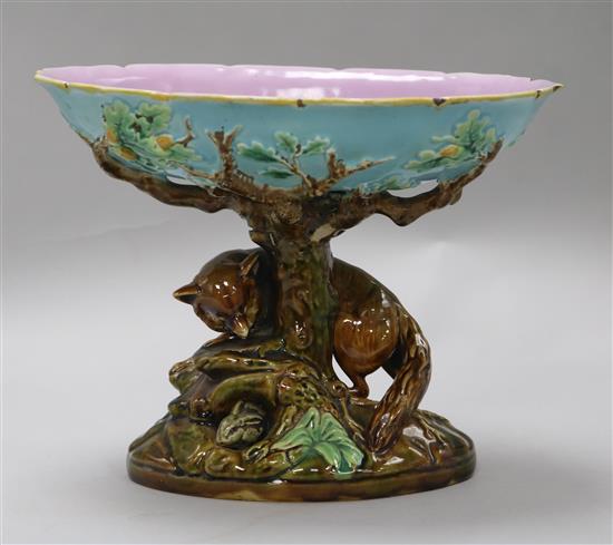 A George Jones majolica comport, the pedestal modelled as a tree trunk with a fox chasing a rabbit,